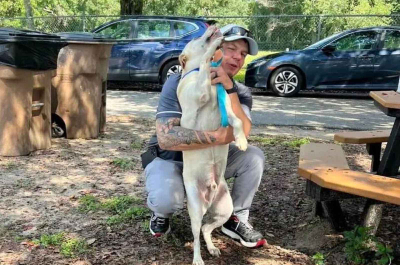 man hugging the dog