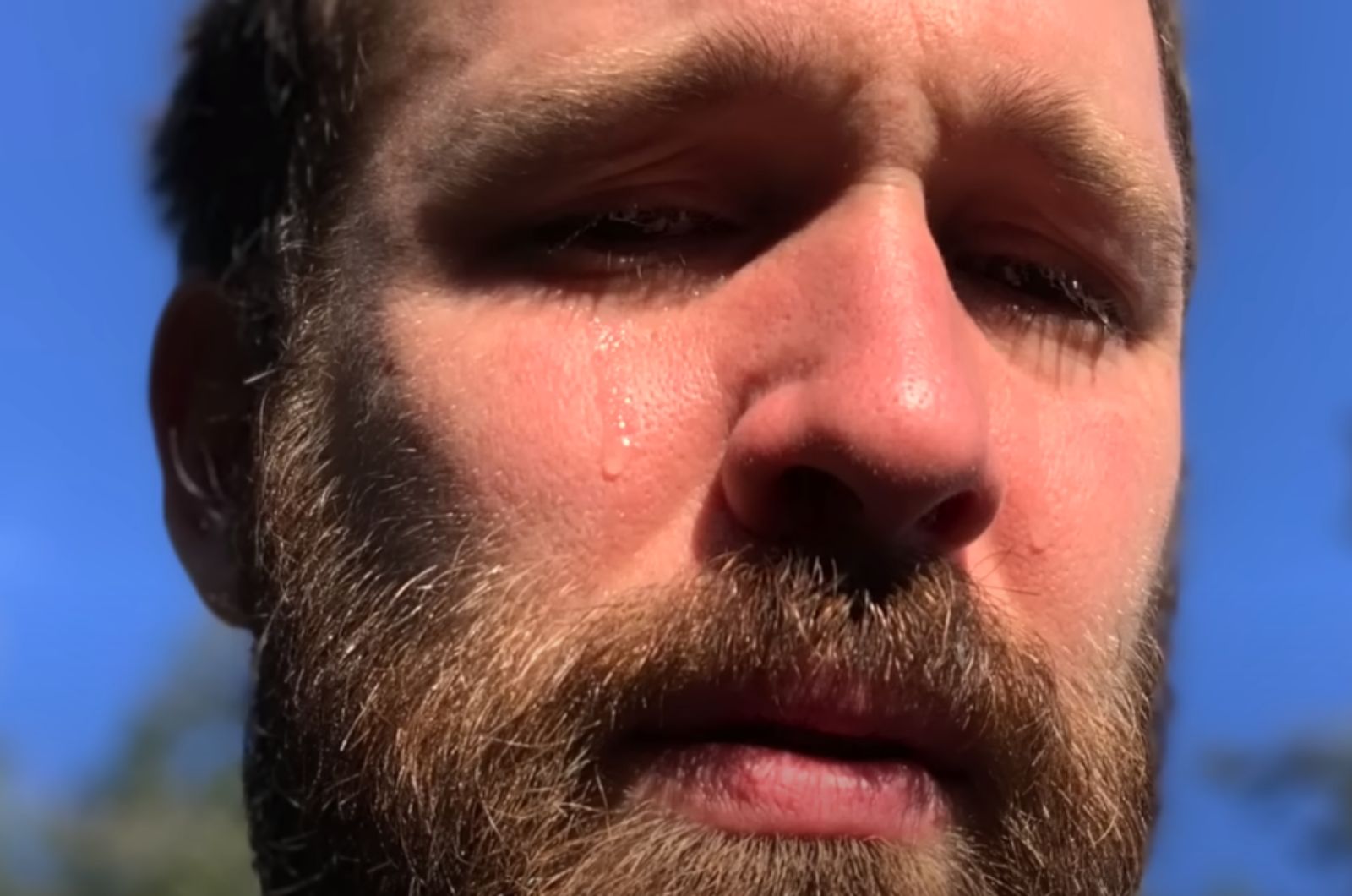 man is crying for a cat