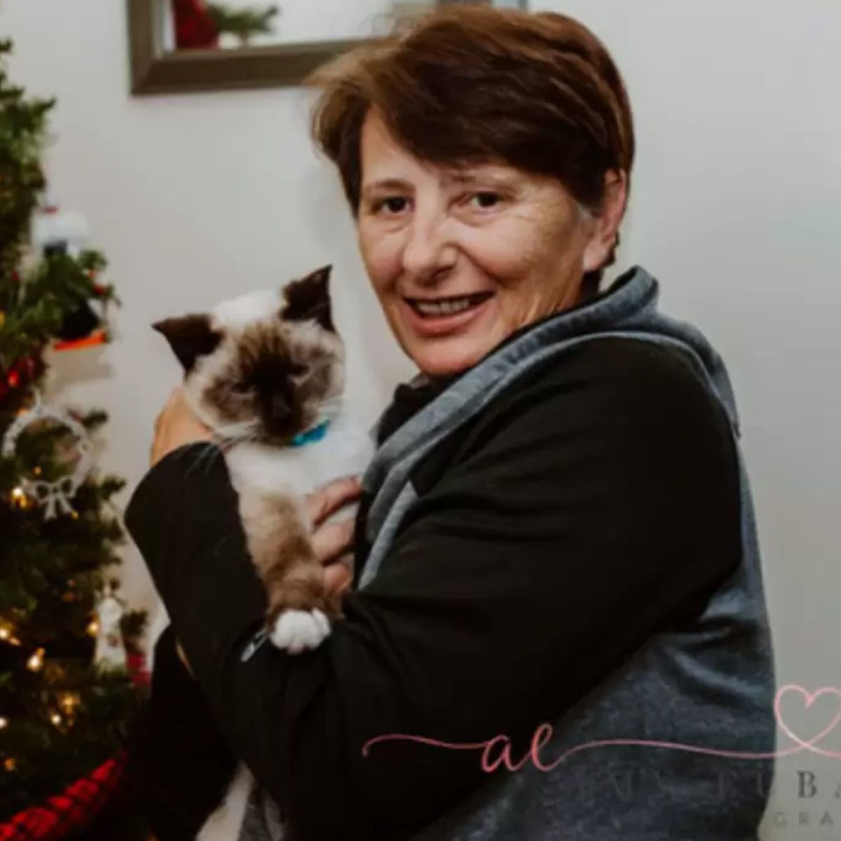 older woman with a cat in her arms