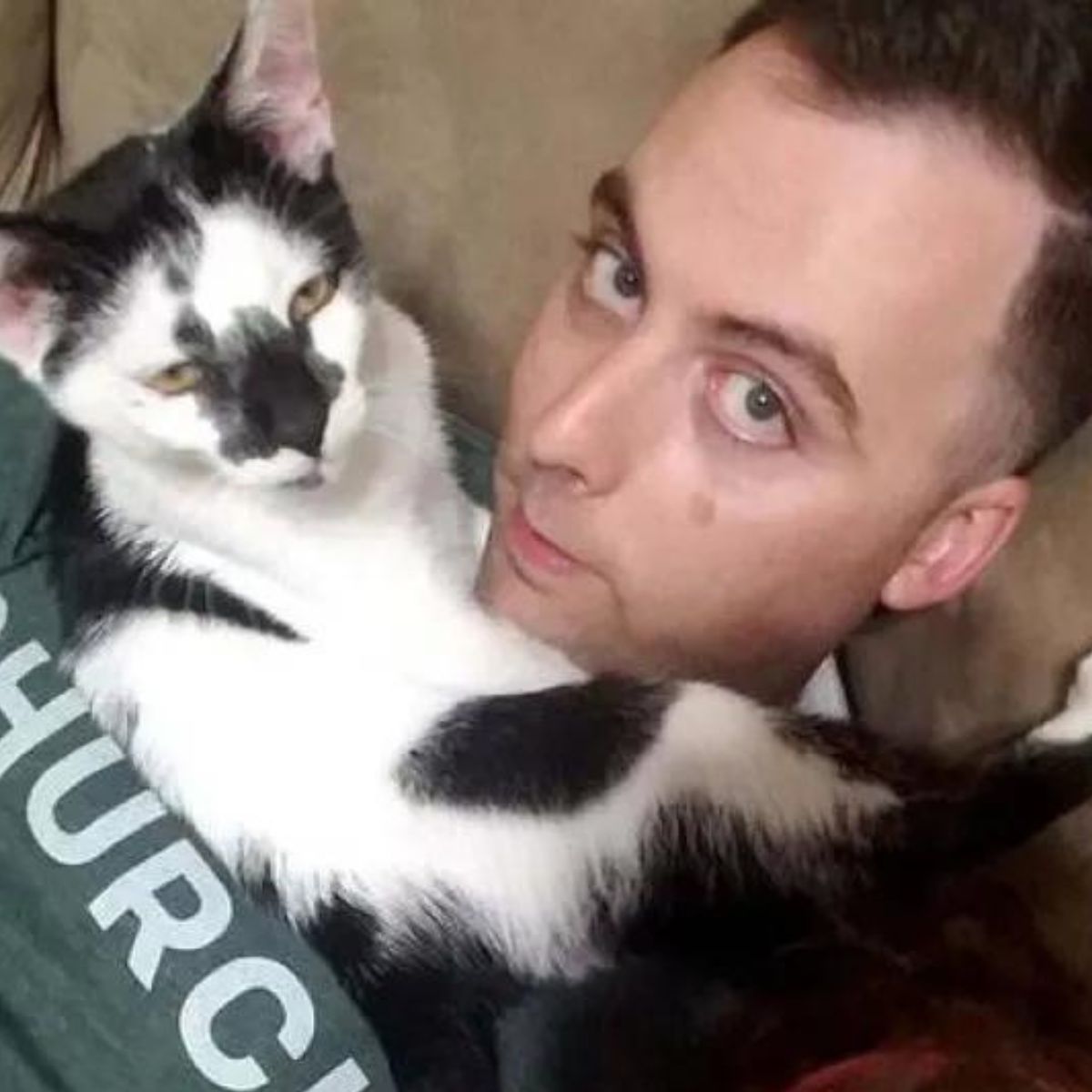 policeman and the cat cuddle