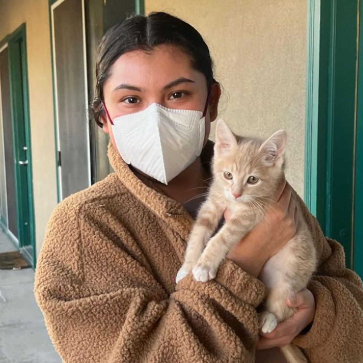 woman and a little kitten