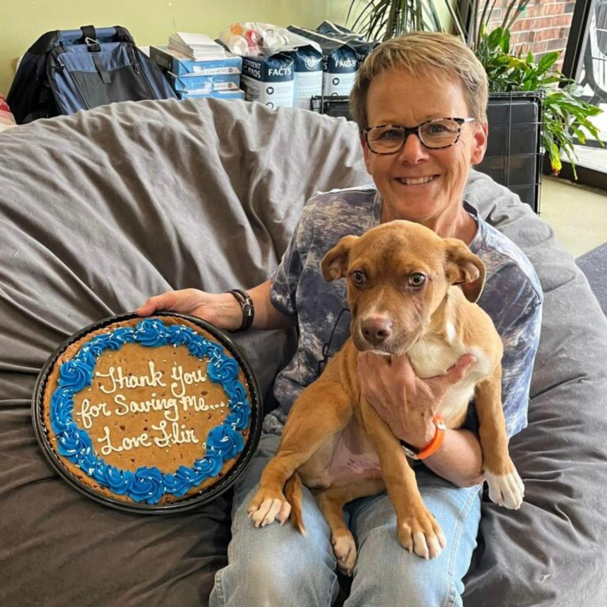 woman and dog with a cake