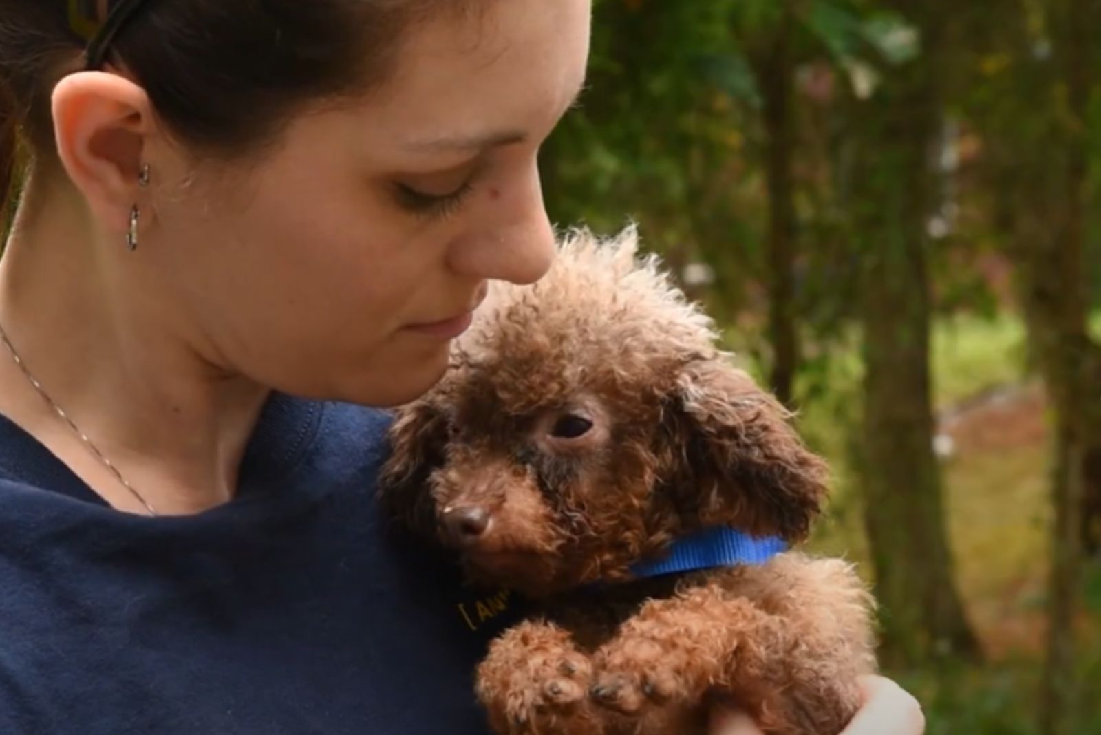 woman holding a dog