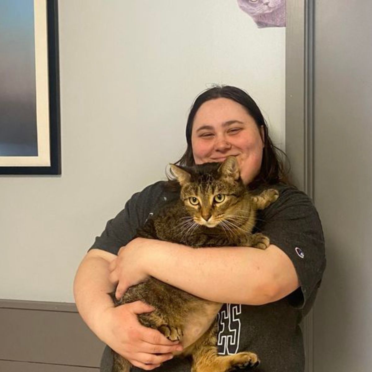 woman holding the cat