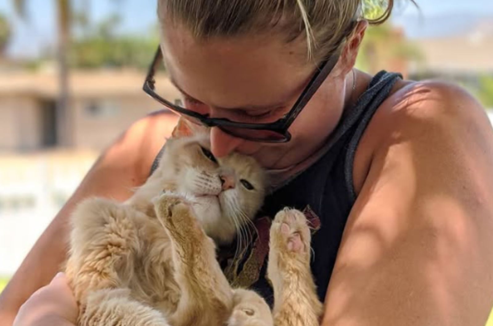 woman holding the cat