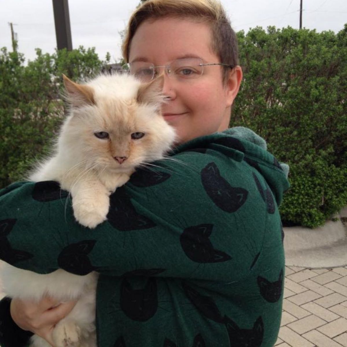 woman holding the cat