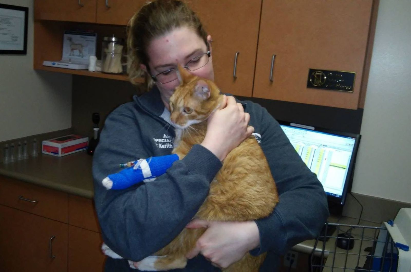 woman holding the cat
