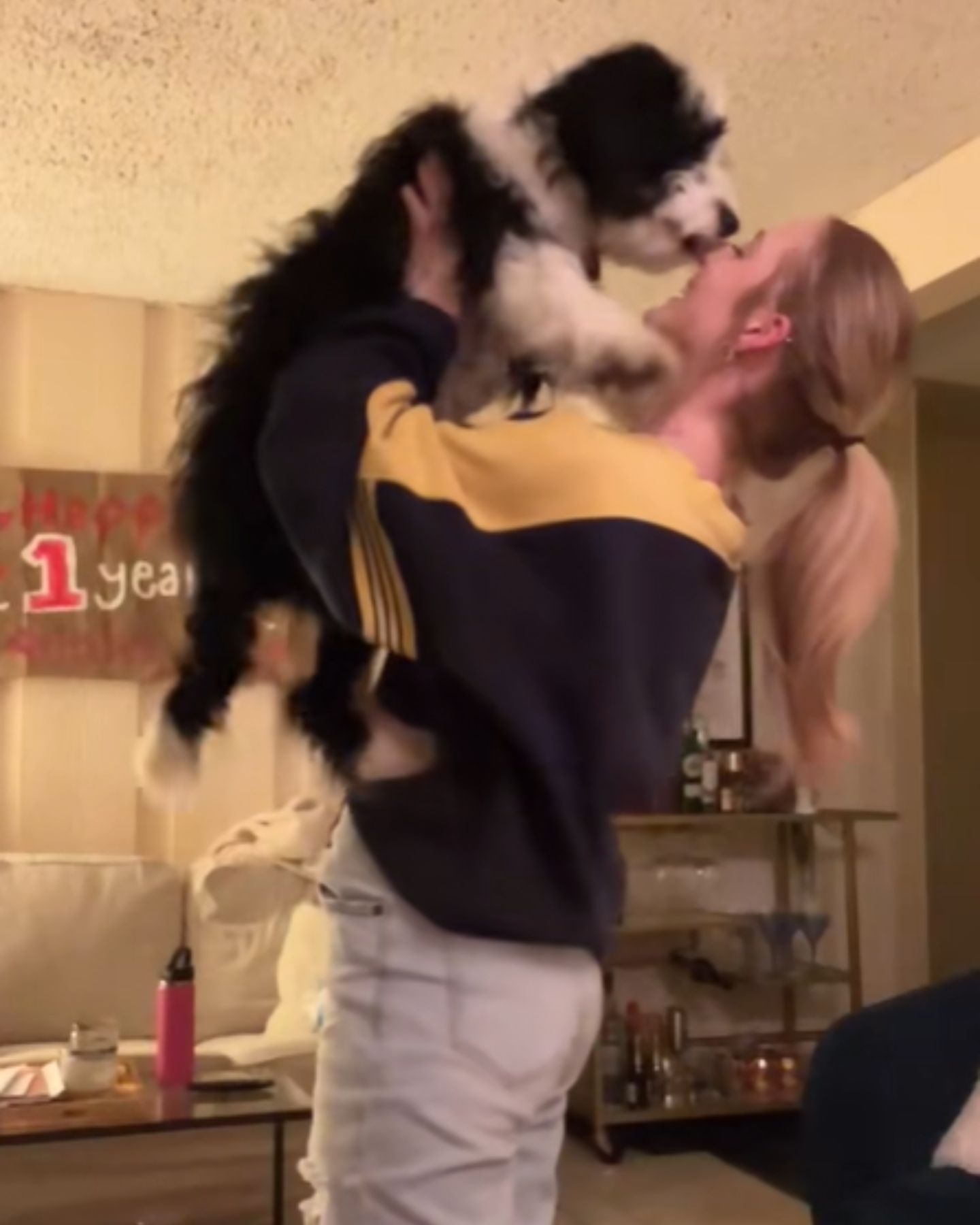 woman holding the dog