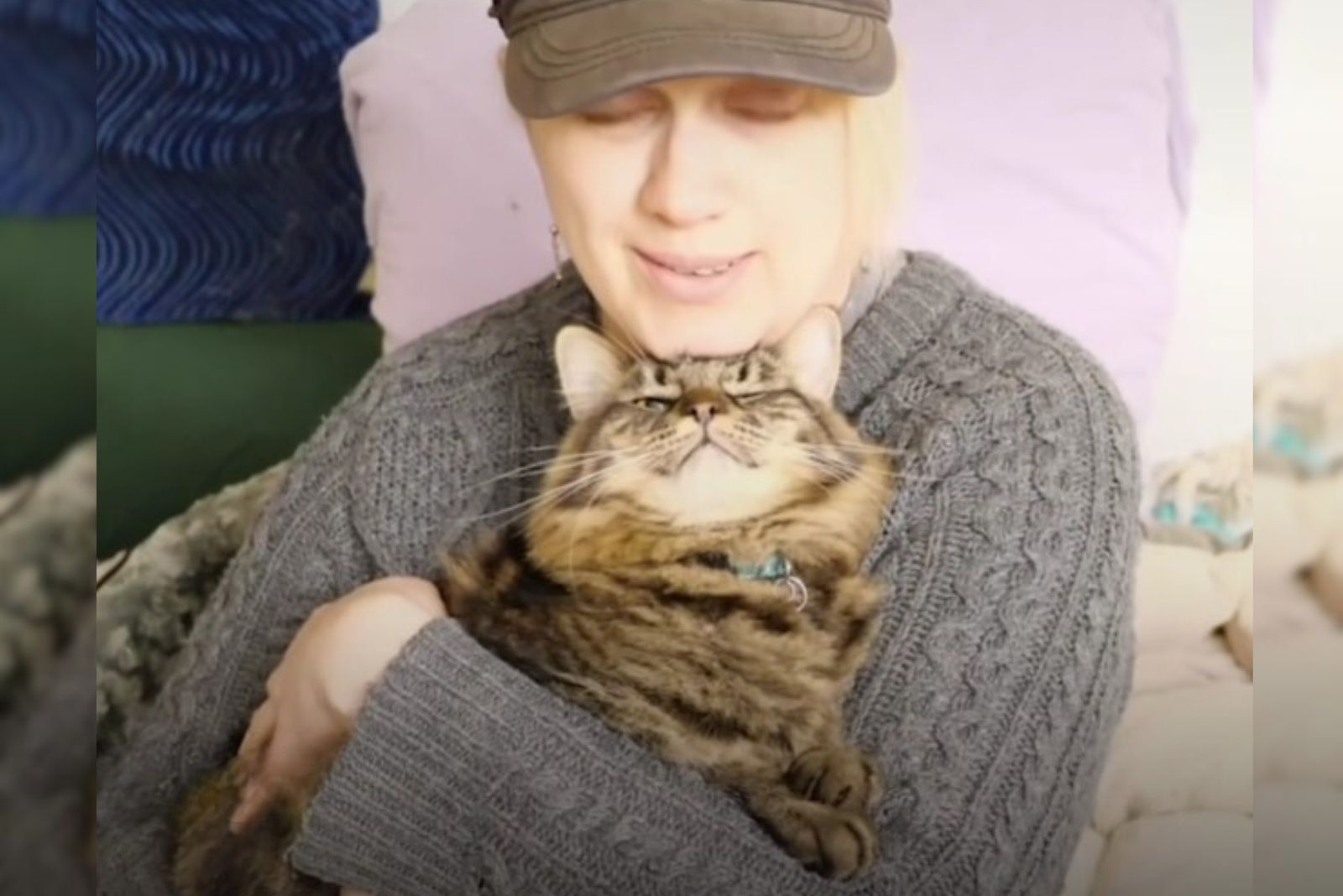 woman hugging a cat