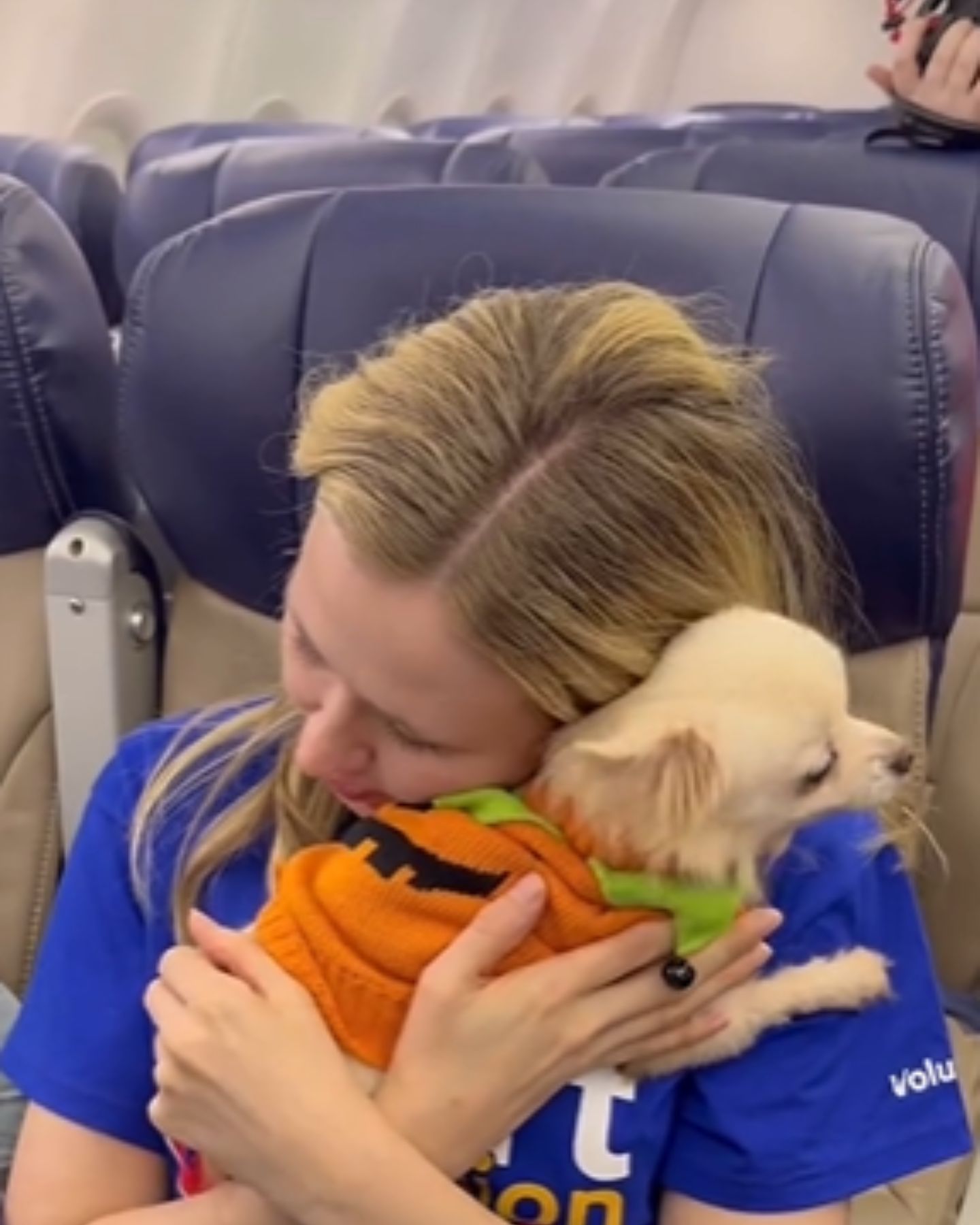 woman hugging the dog