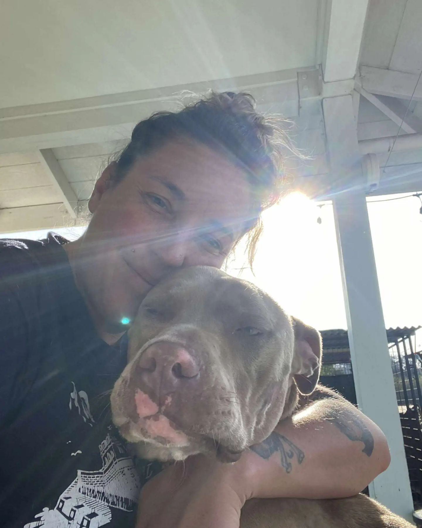 woman hugging the dog