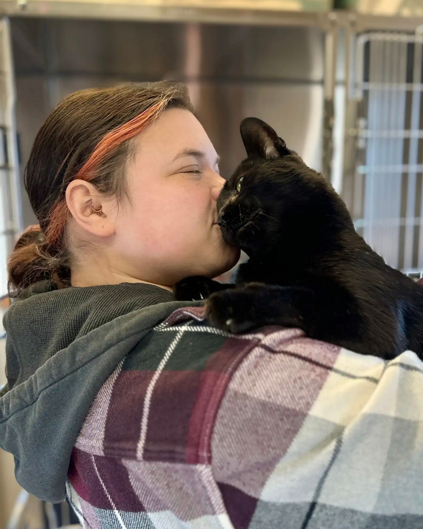 woman kissing the cat