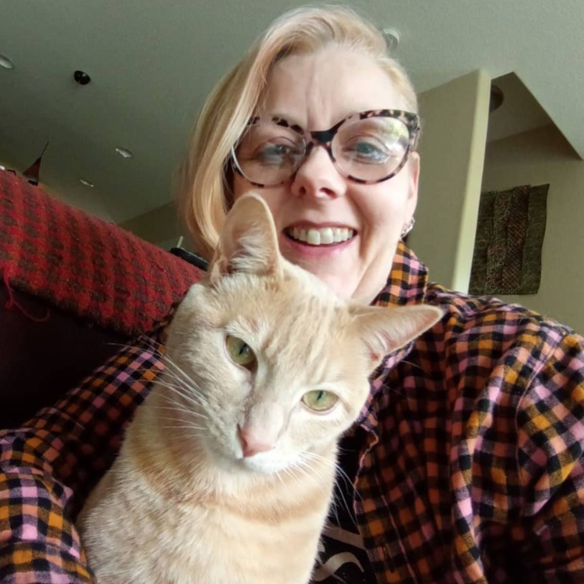 woman with an orange cat