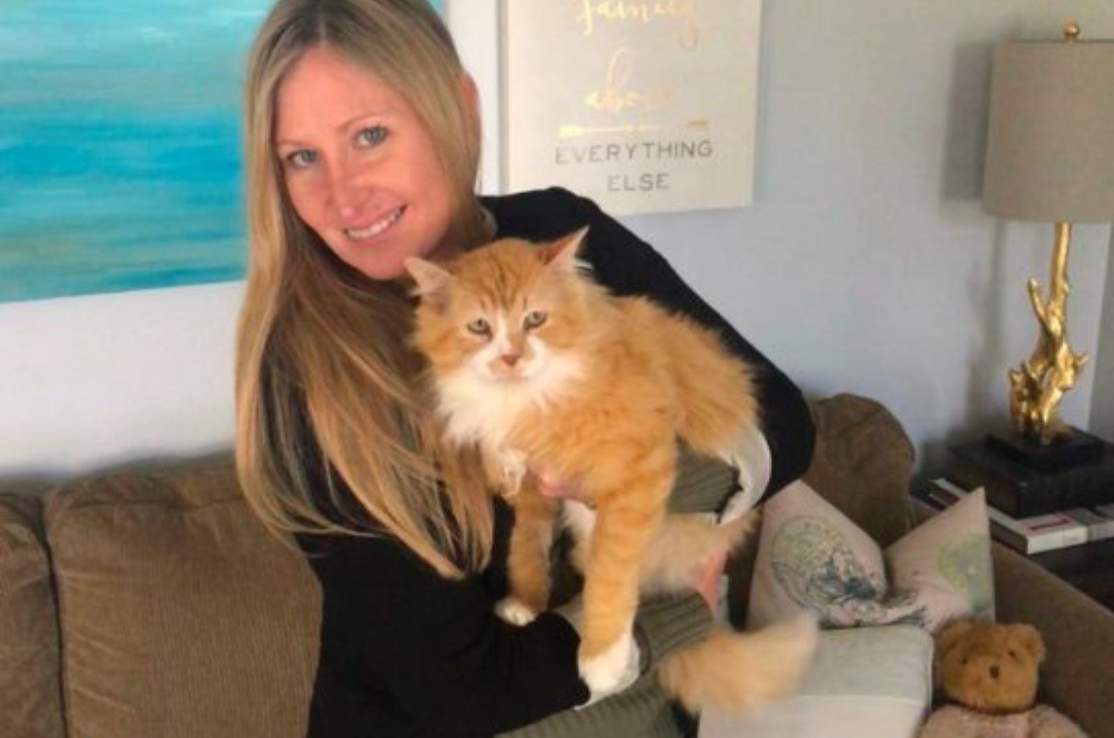woman with orange cat