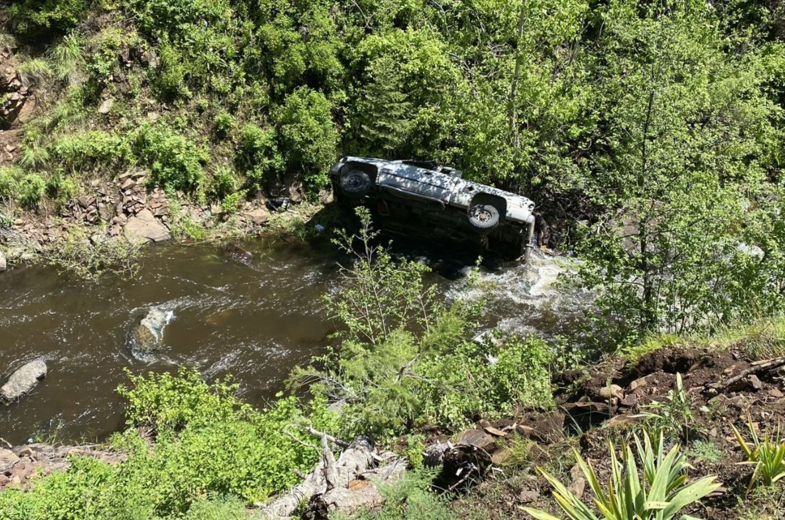 wrecked car in river
