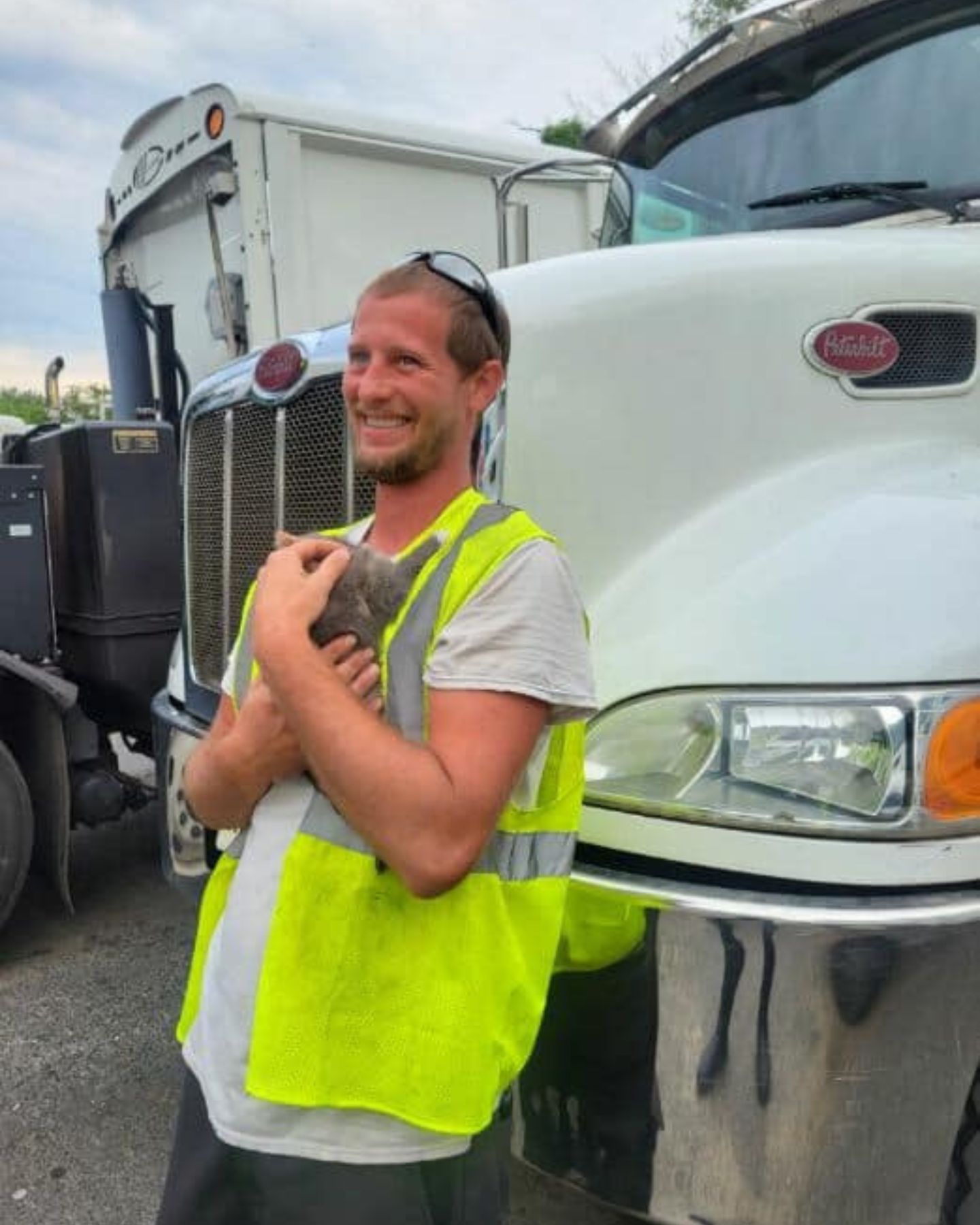 Man hugging kitten