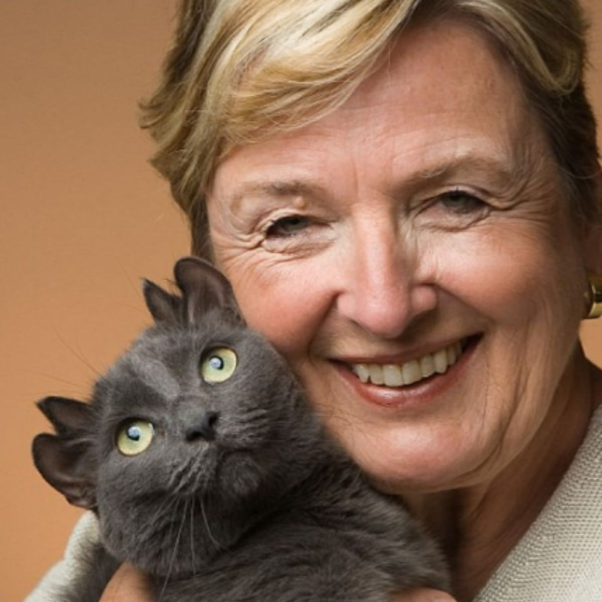 cat with four ears and her owner