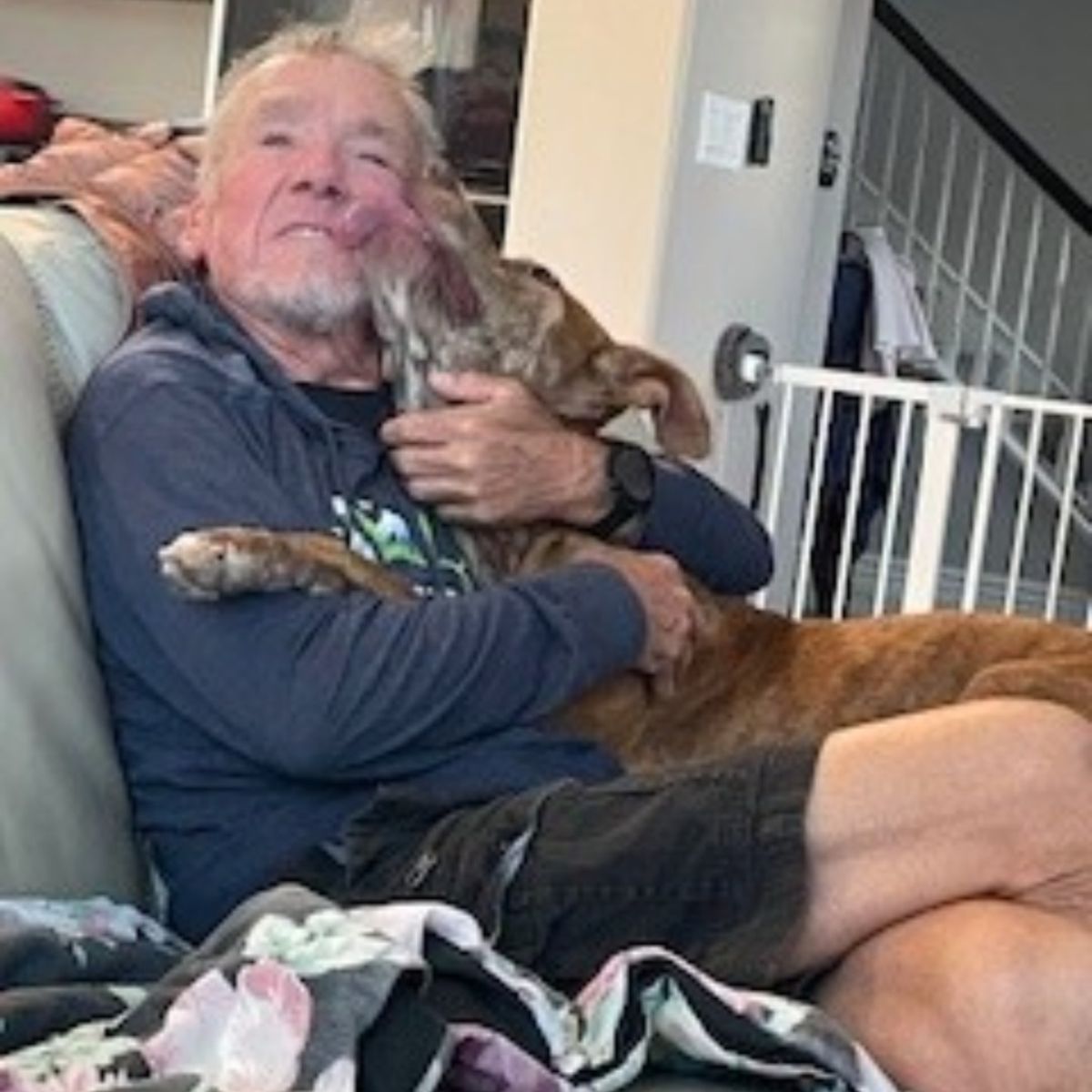 dog licking the man