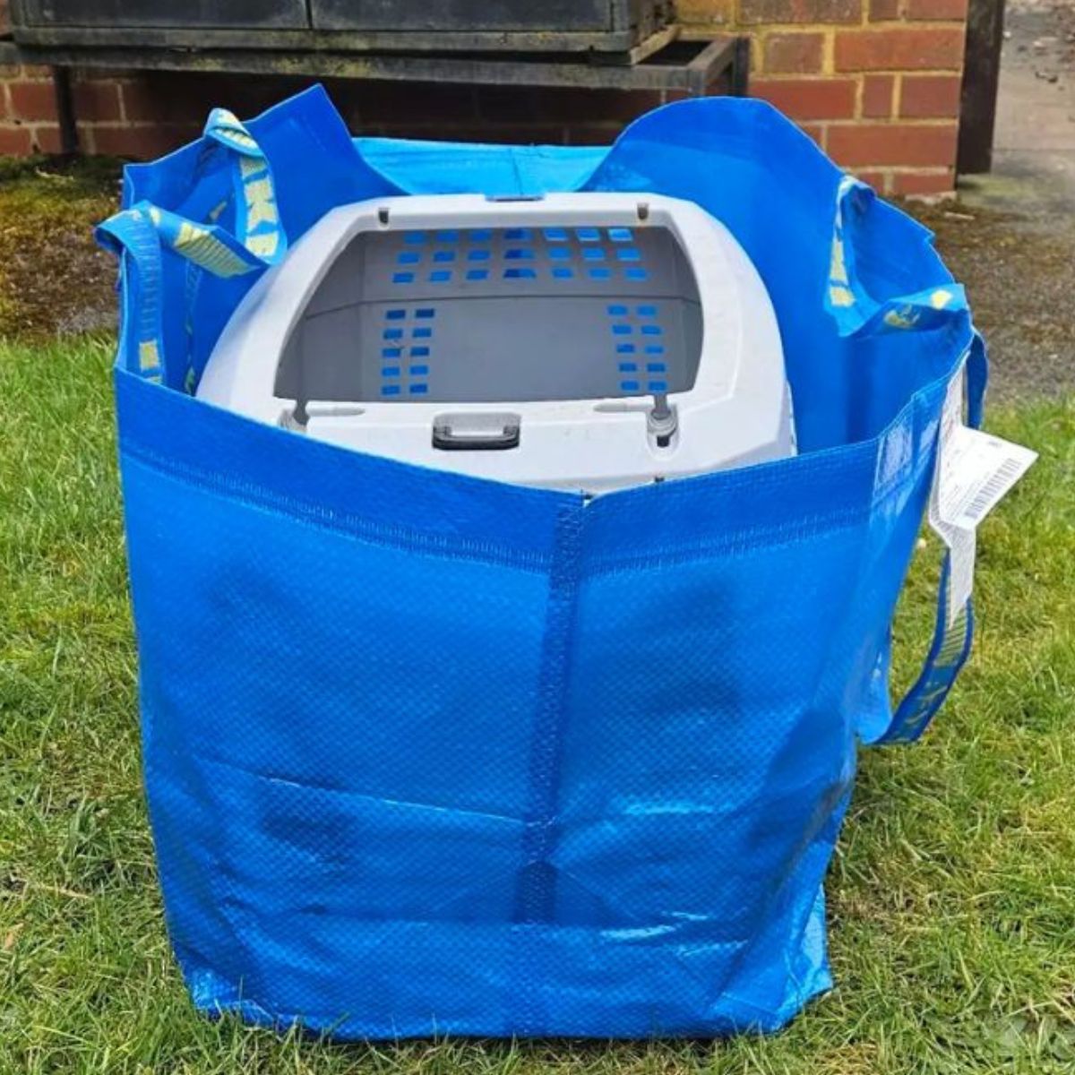 kennel in a blue bag