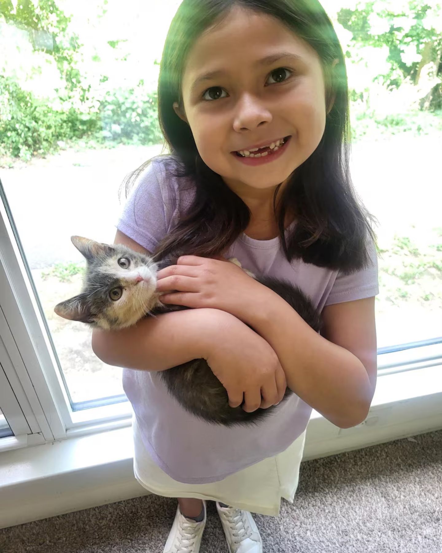little girl and kitten