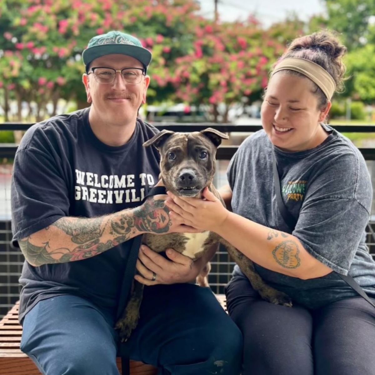 man and a woman adopted a blind dog