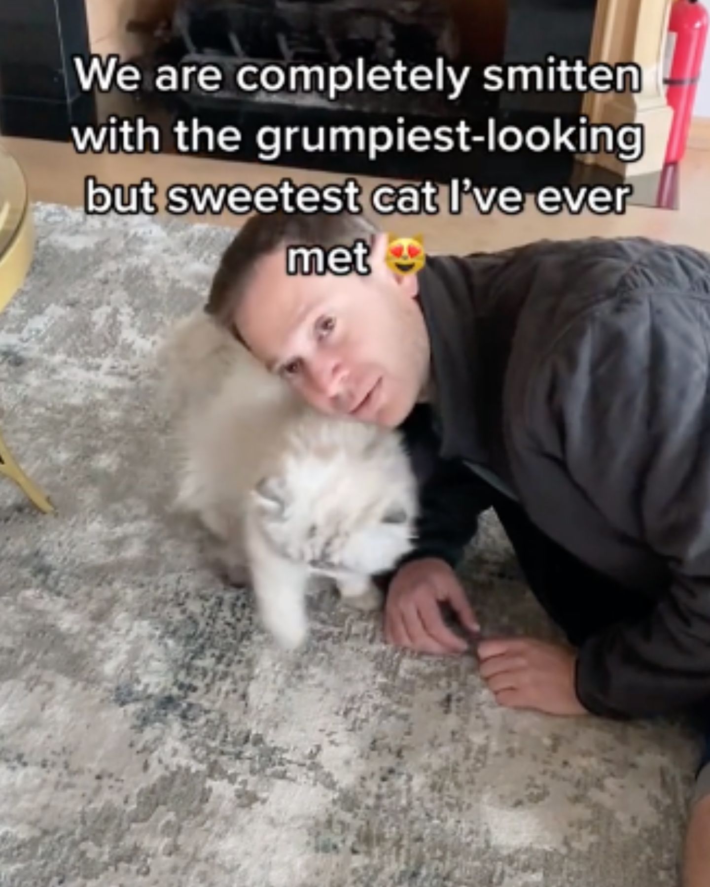 man and cat on the floor