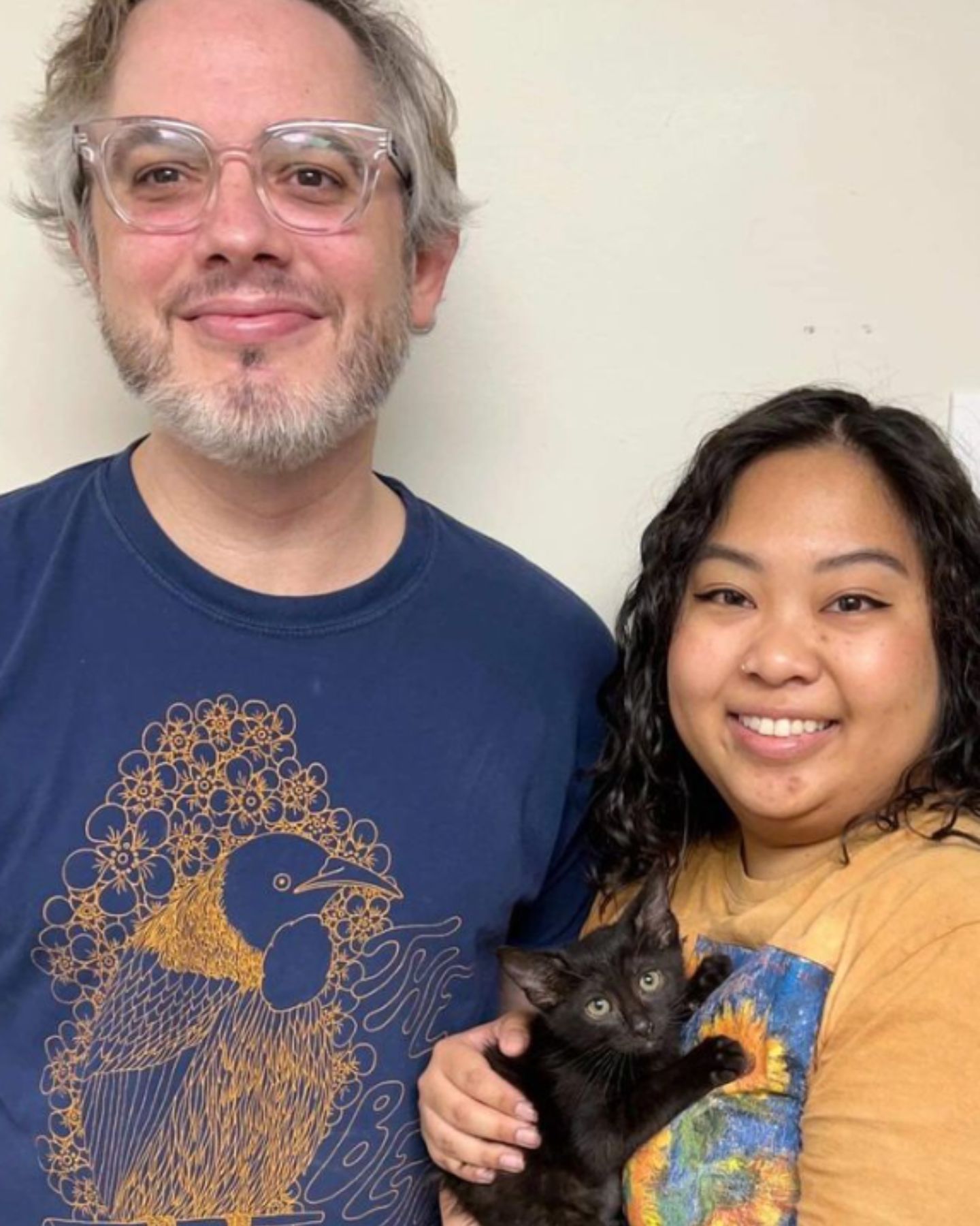 man and woman with the kitten