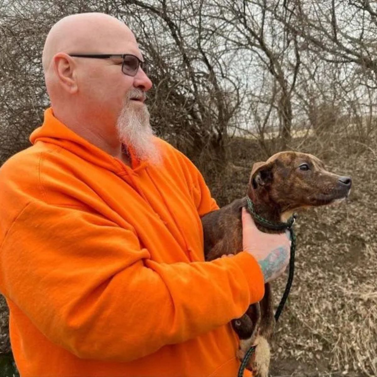 man holding the dog