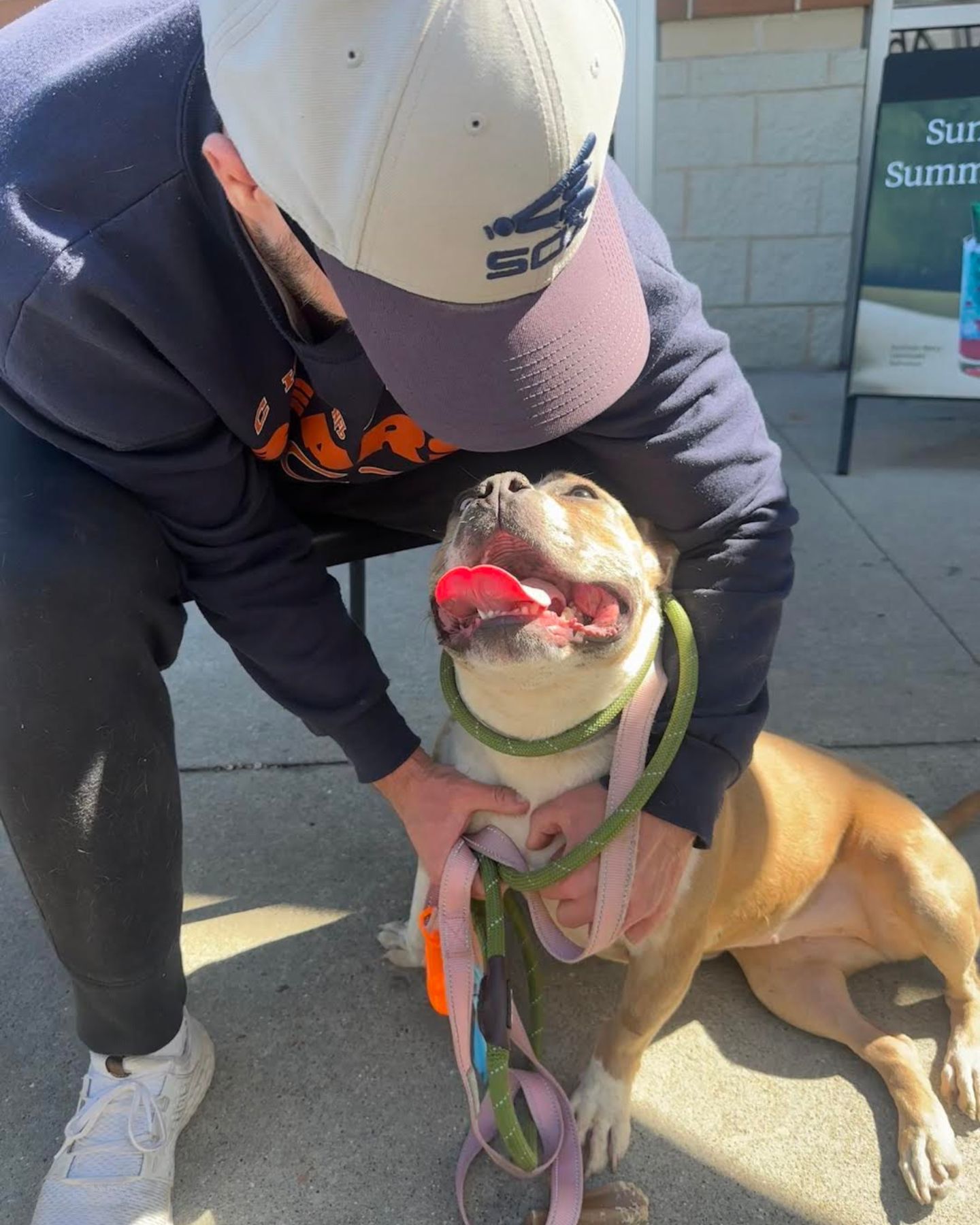 man hugging the dog
