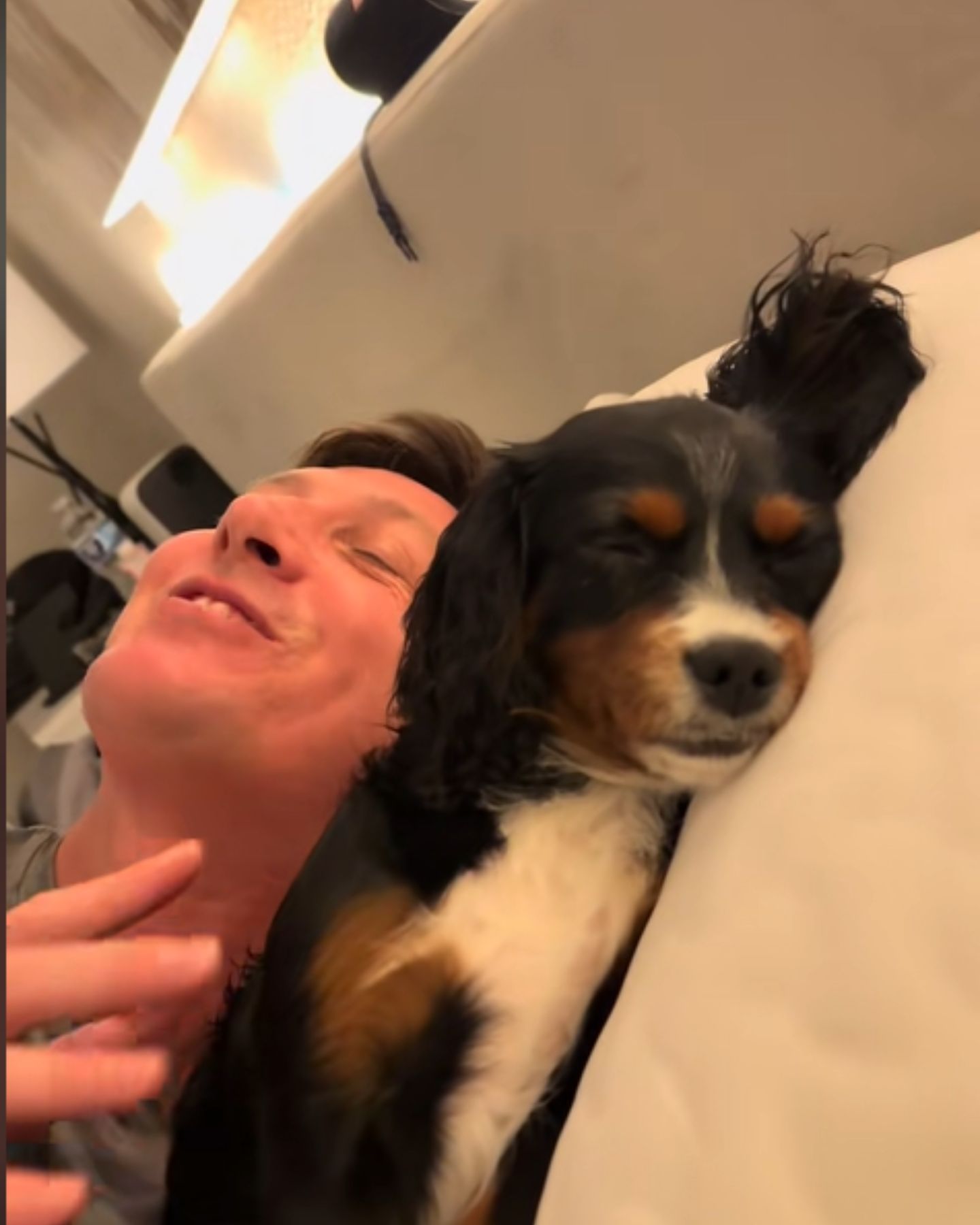 man laughing at the dog