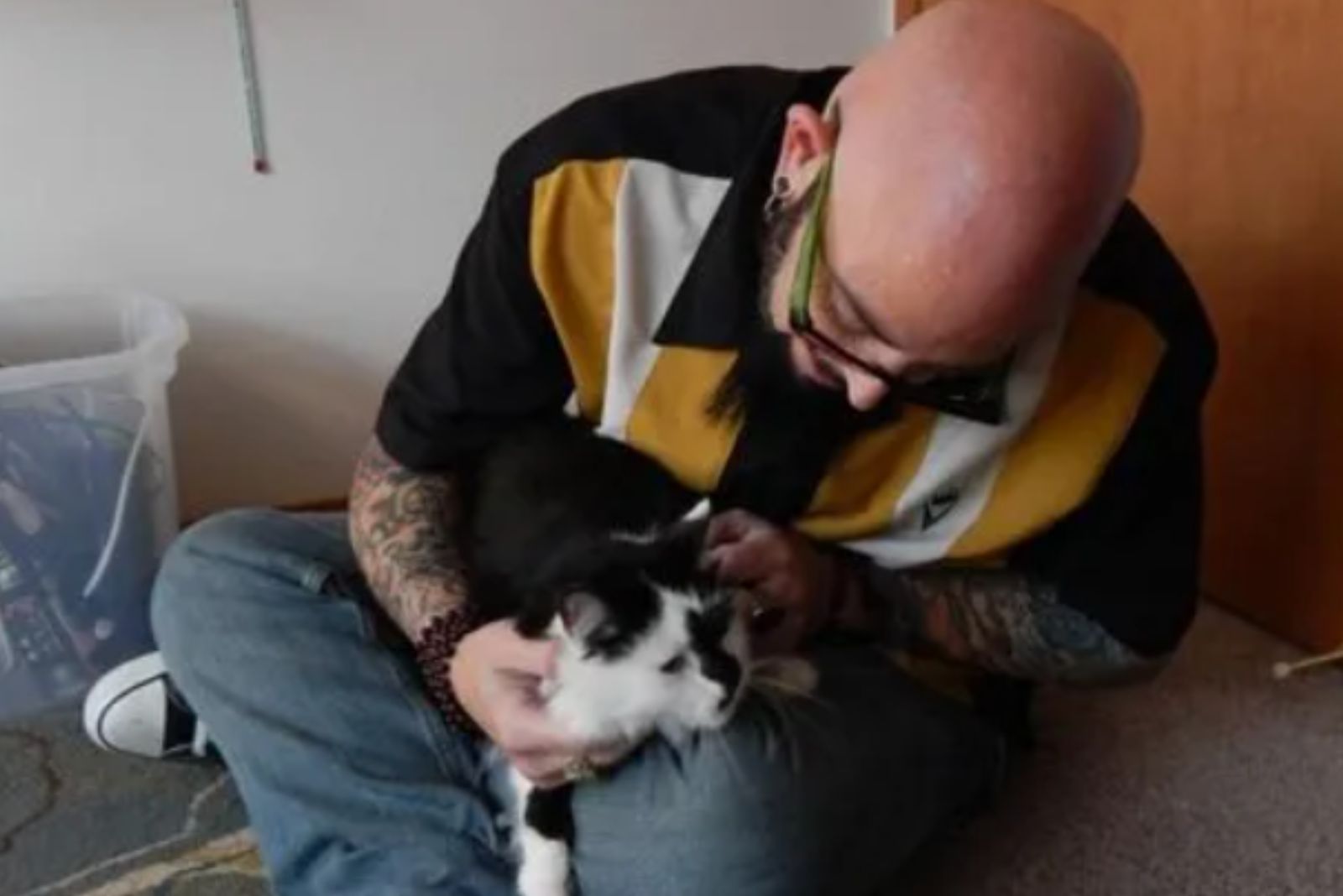 man petting the cat