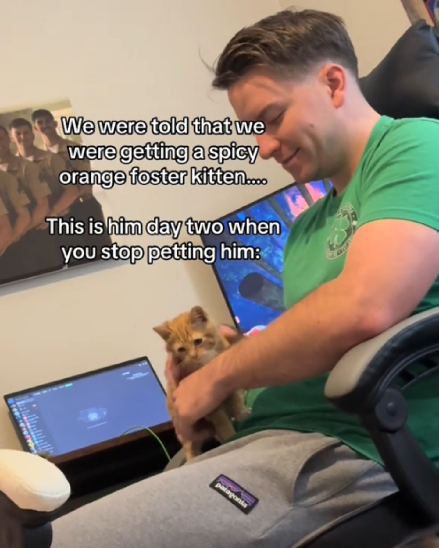 man petting the kitten