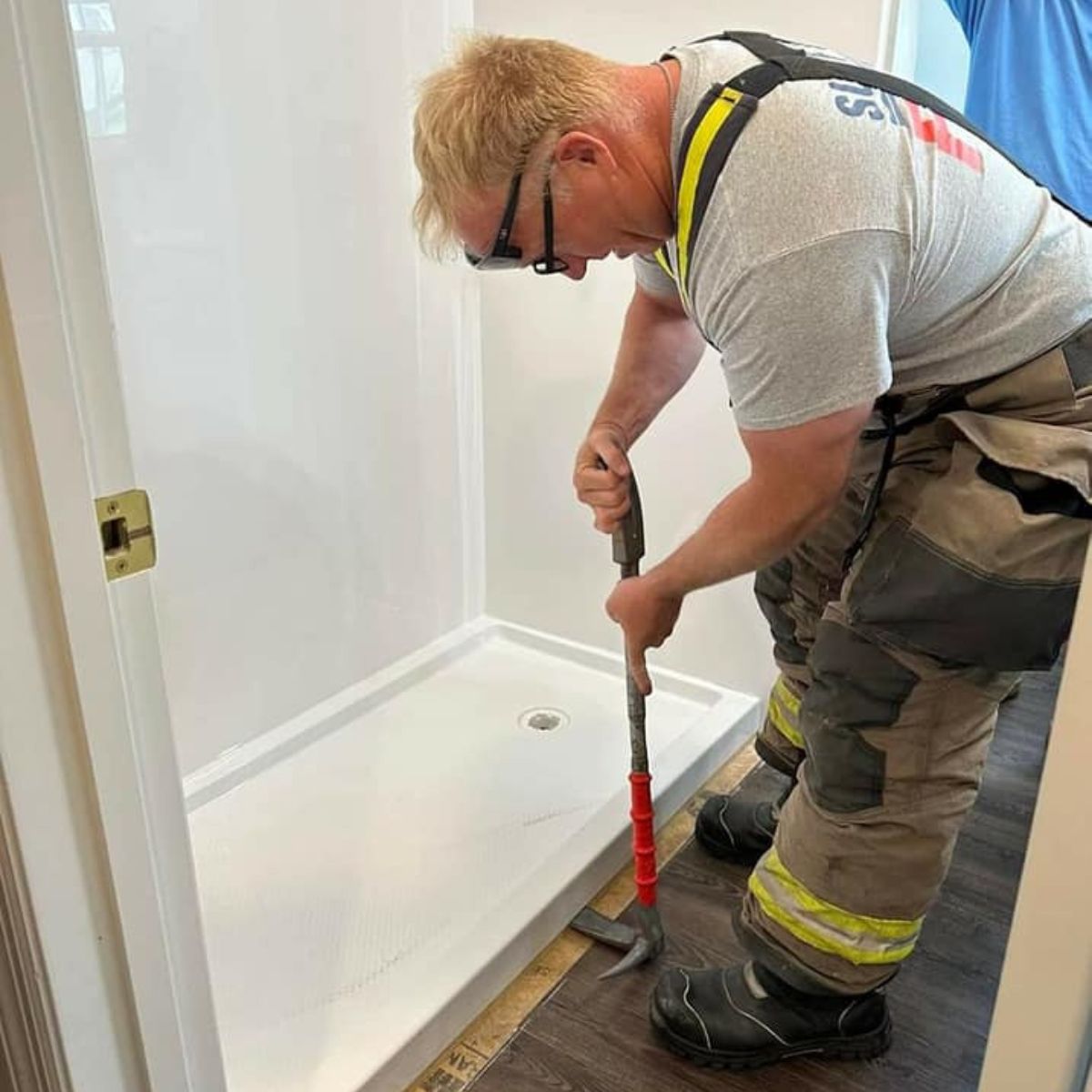 man remodeling bathroom