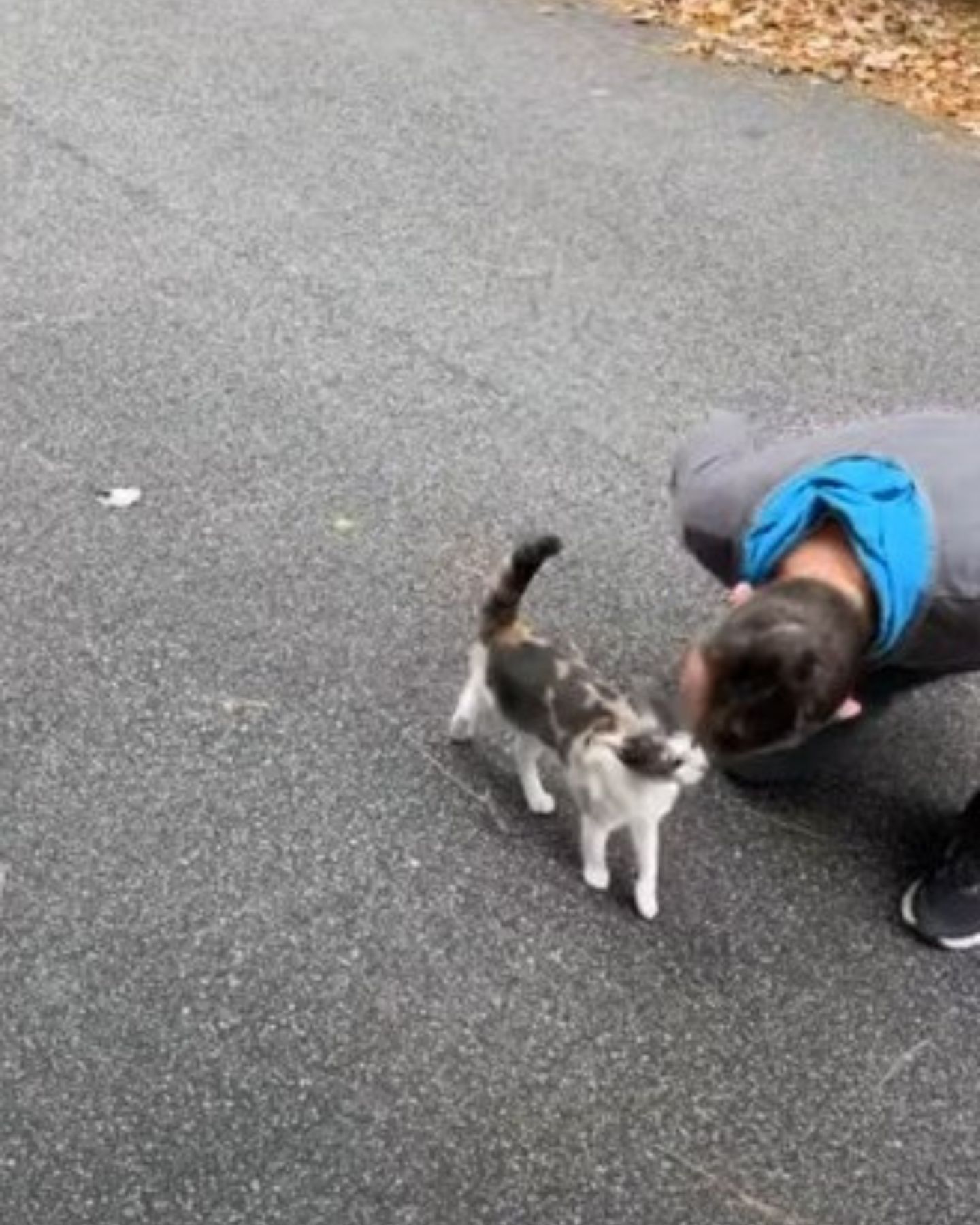 man with rescued cat