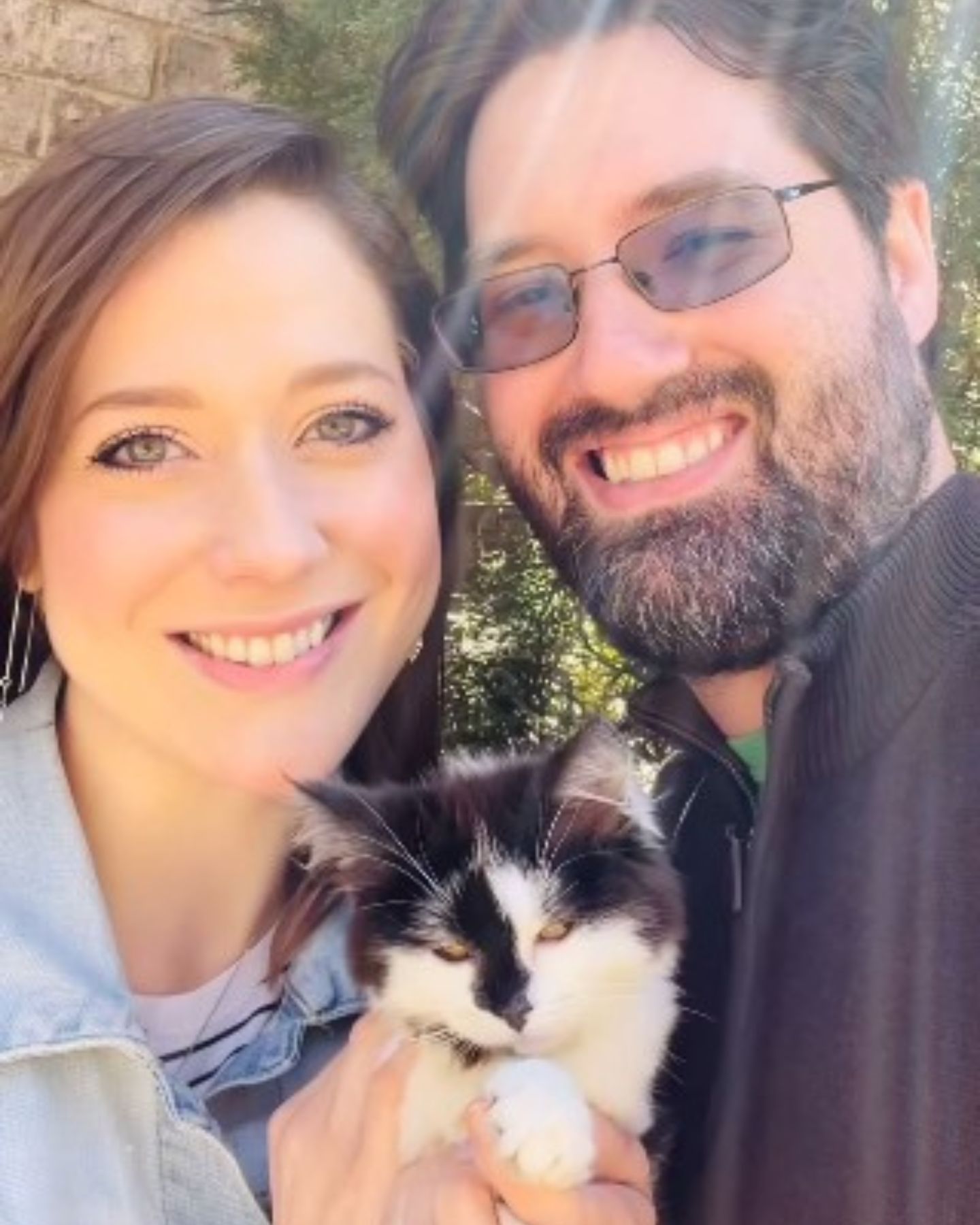 man woman and a cat
