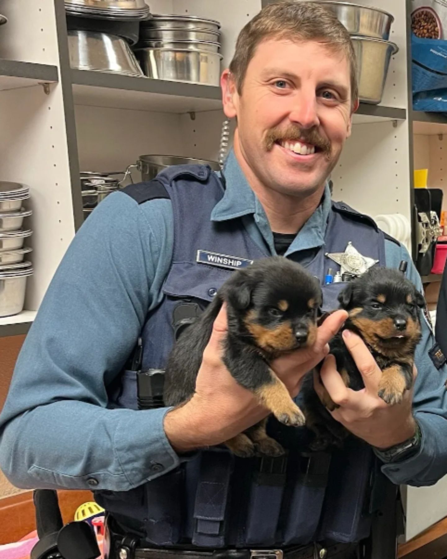 policeman with two small dogs