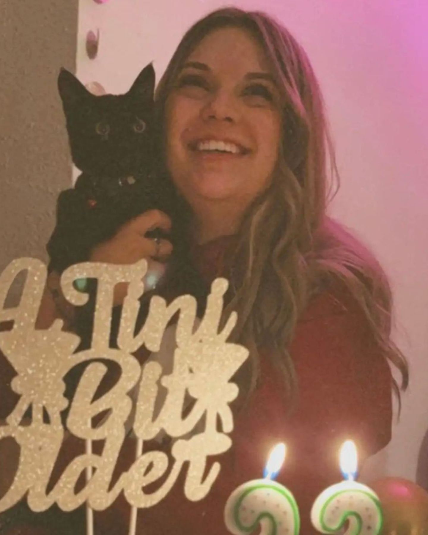 woman and black cat happy