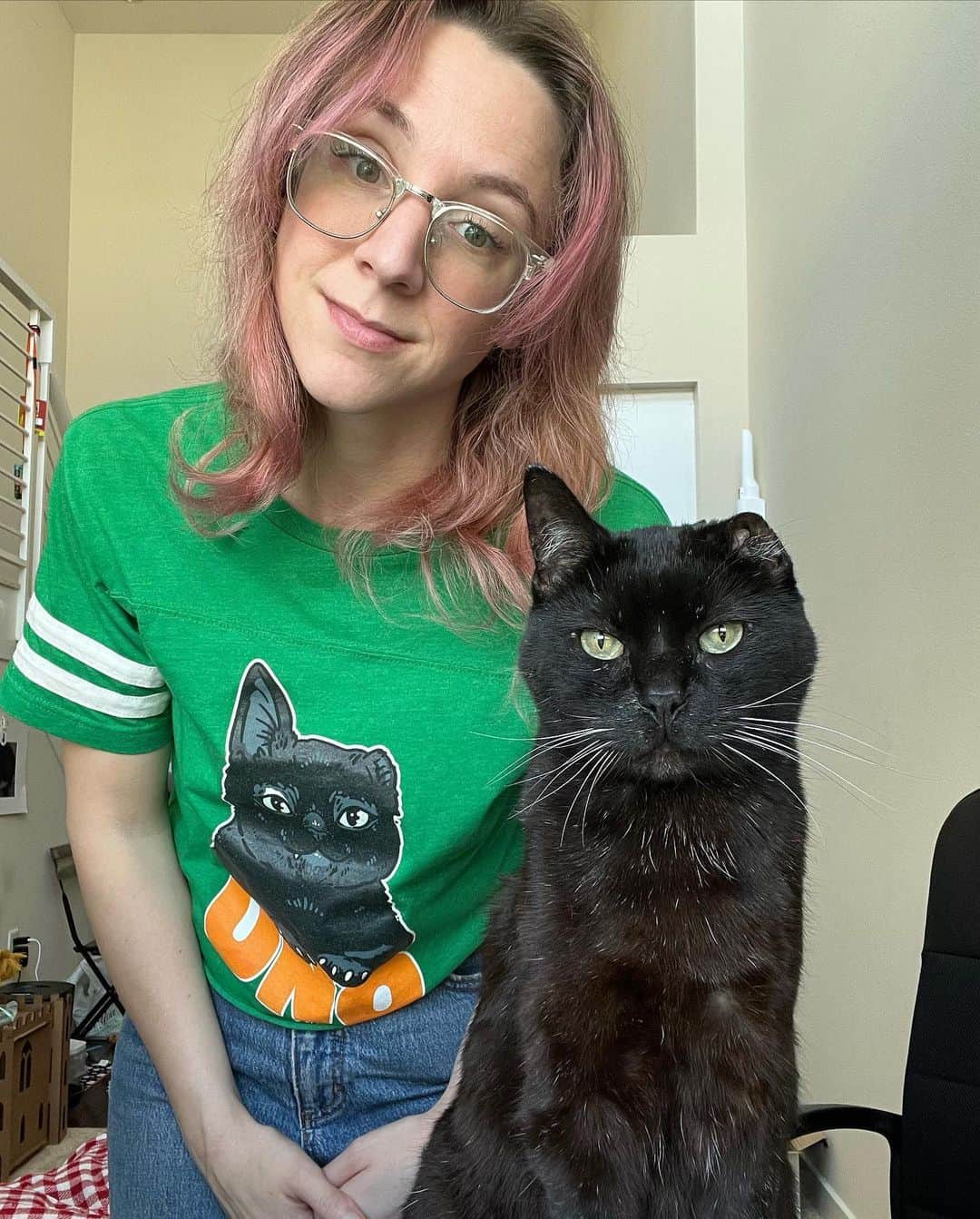 woman and black one eared cat