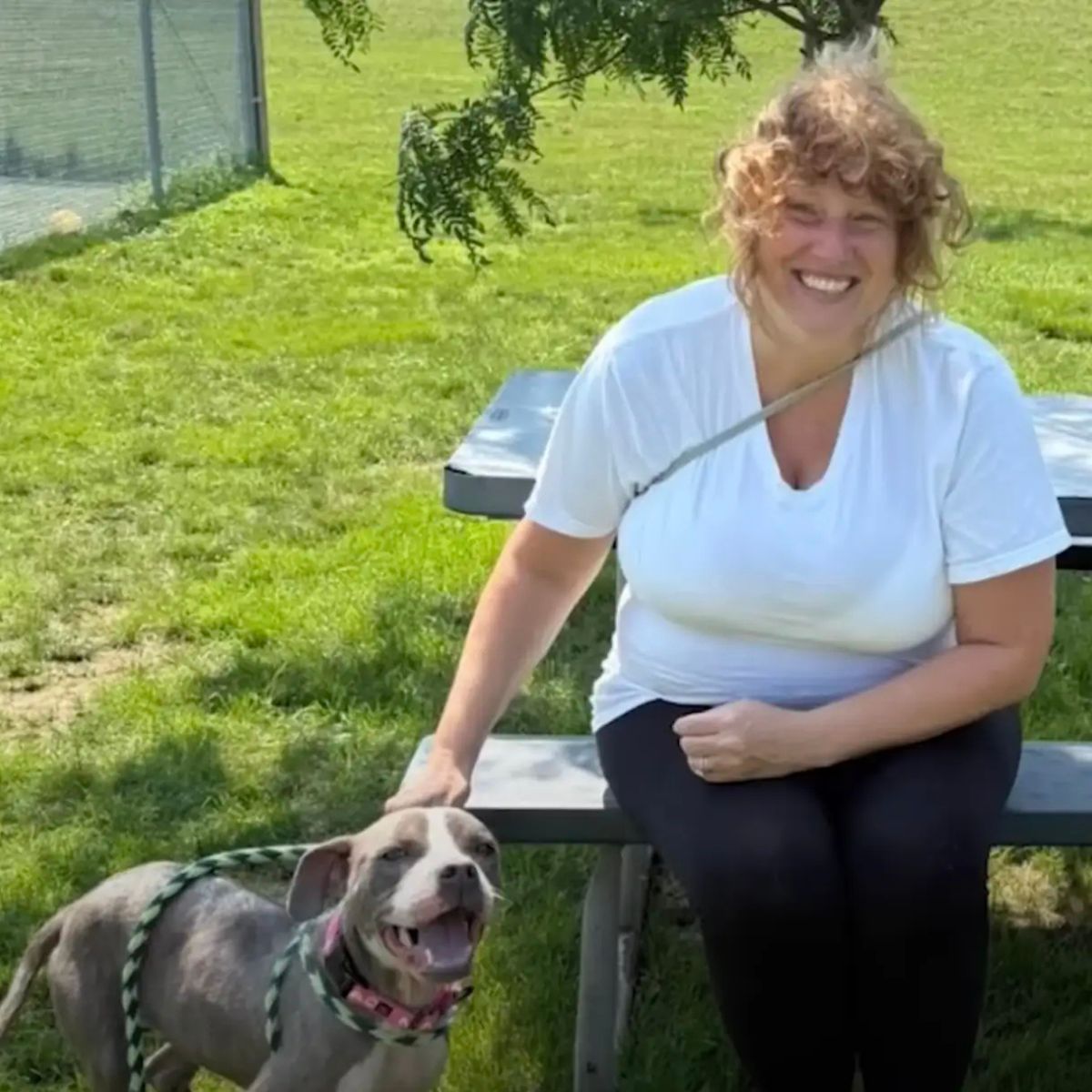 woman and the dog in the yard