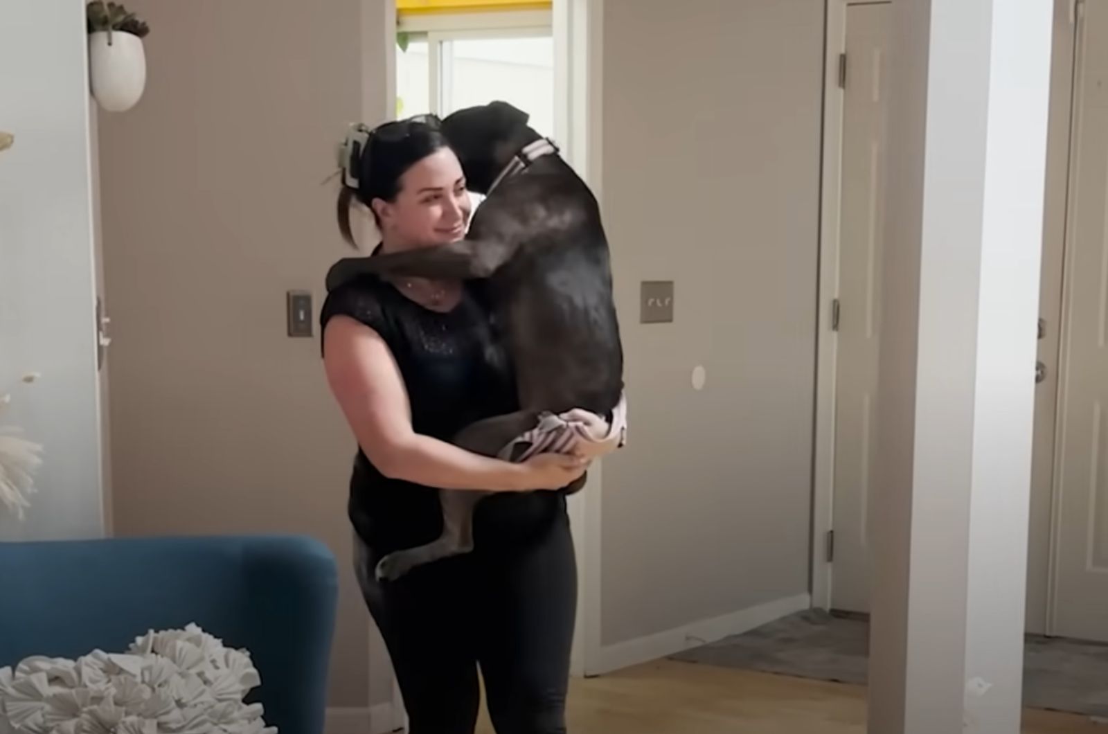 woman carrying the dog
