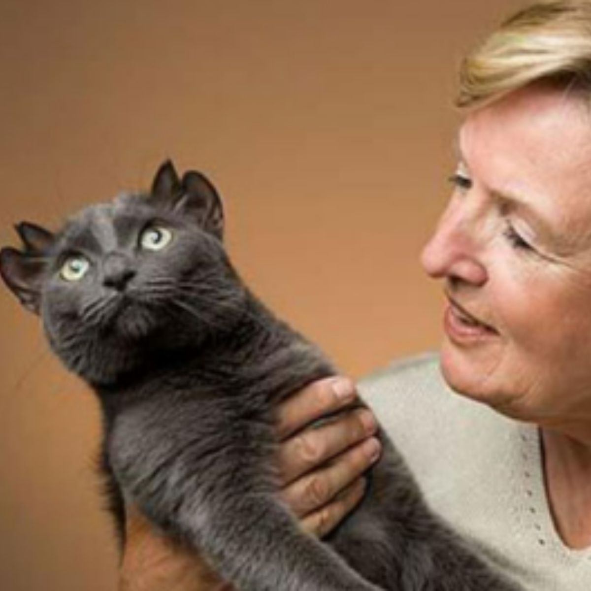 woman holding a cat
