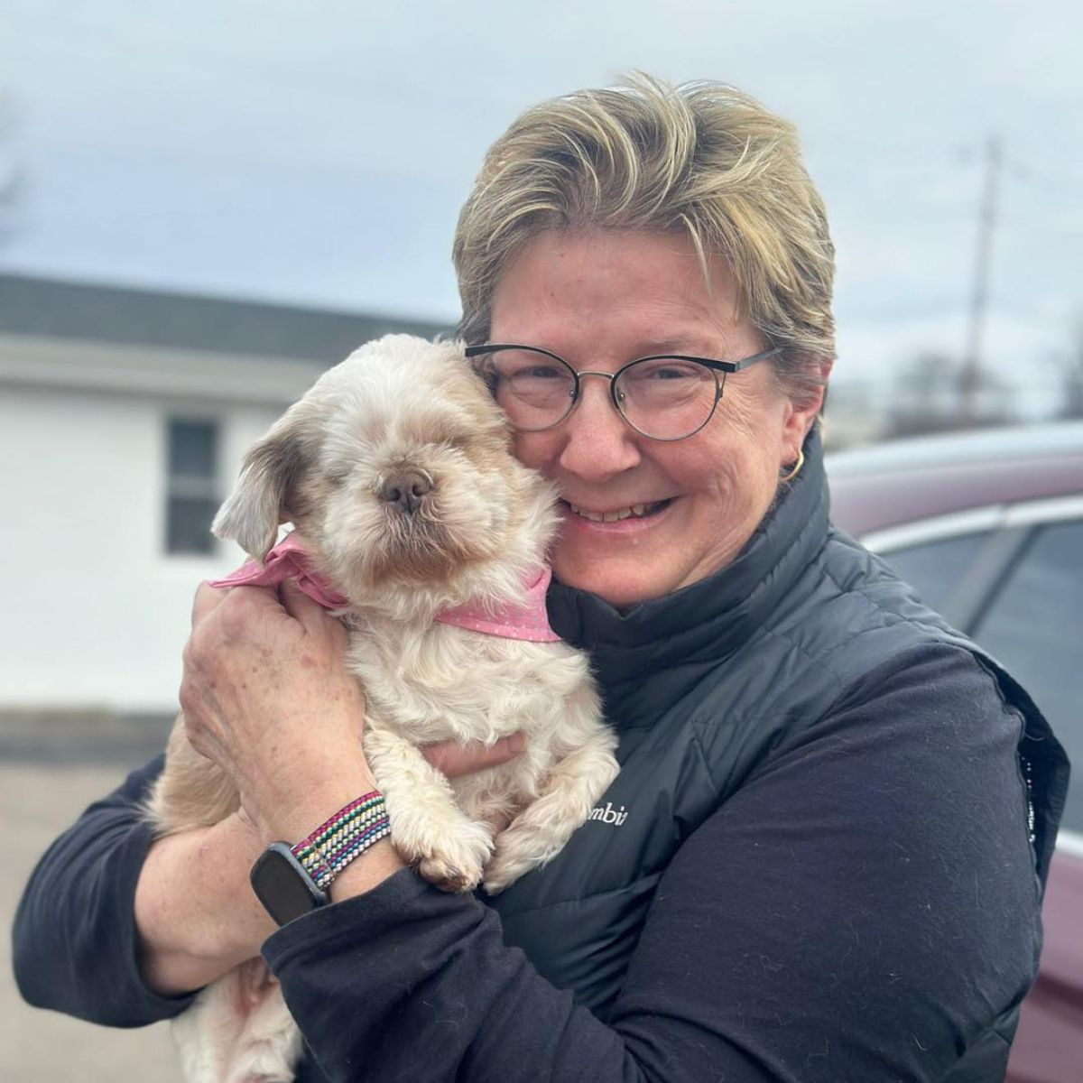 woman holding blind dog