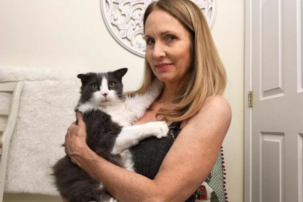 woman holding her cat