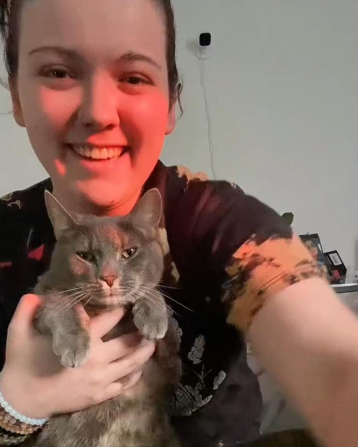 woman holding the cat
