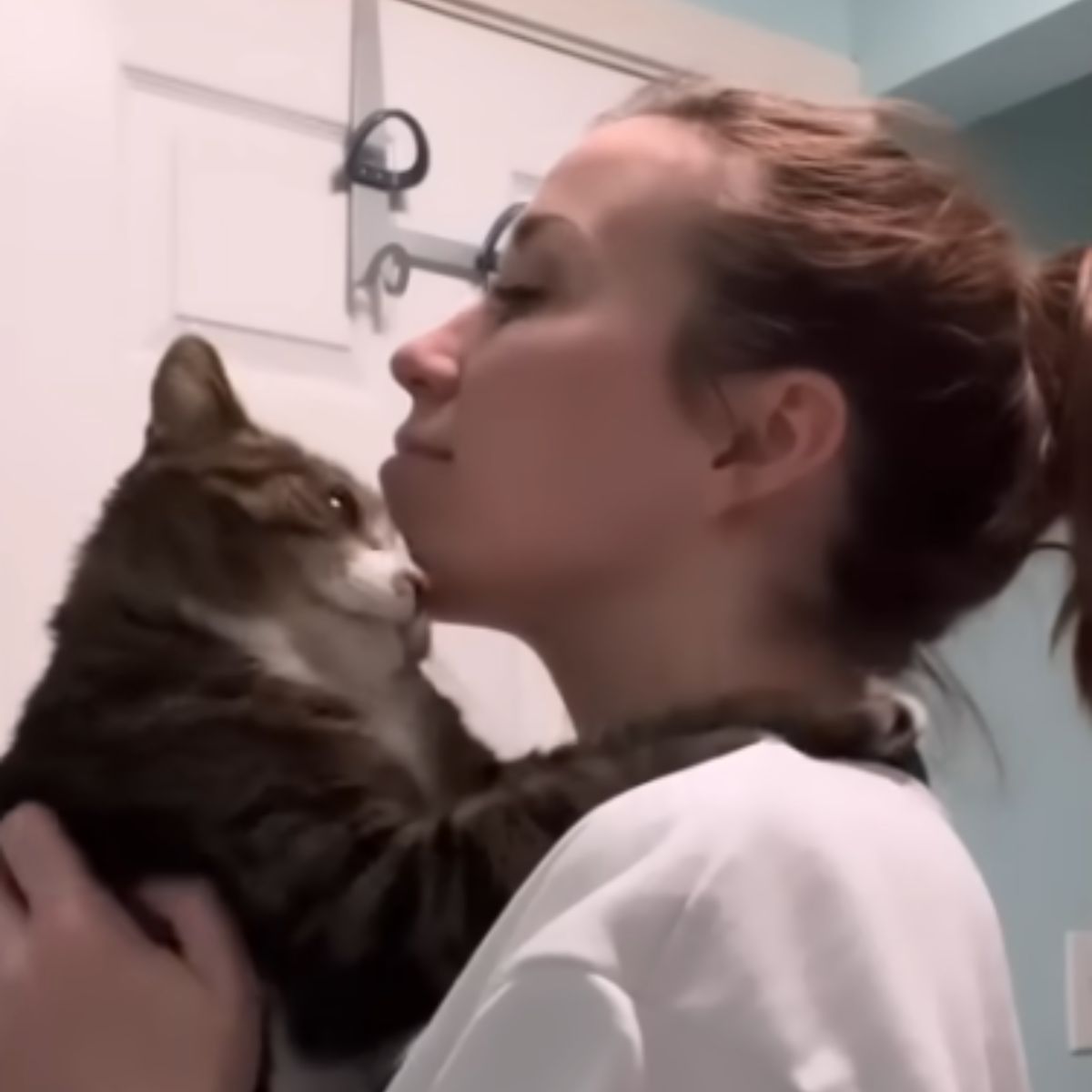 woman holding the cat