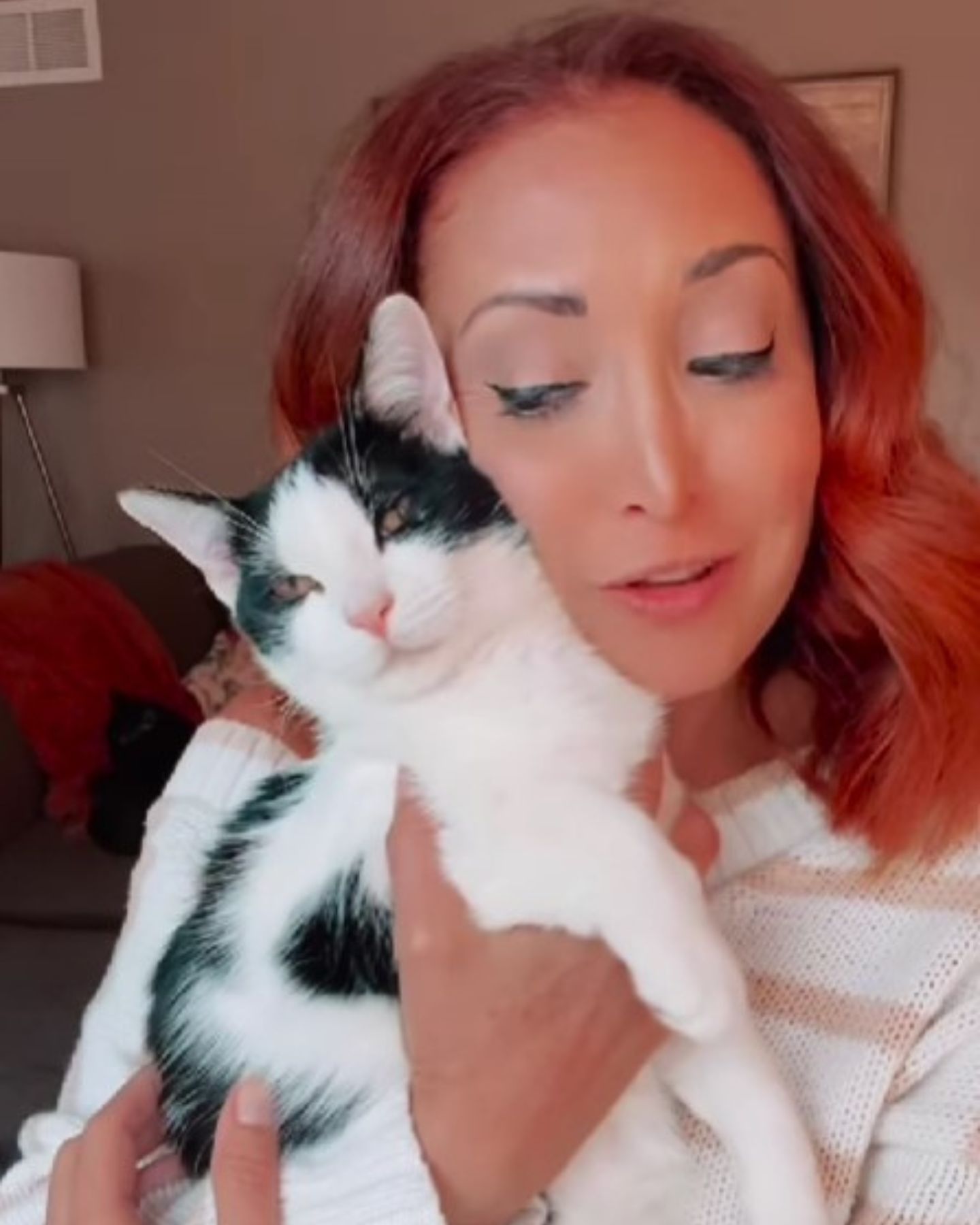 woman holding the kitten