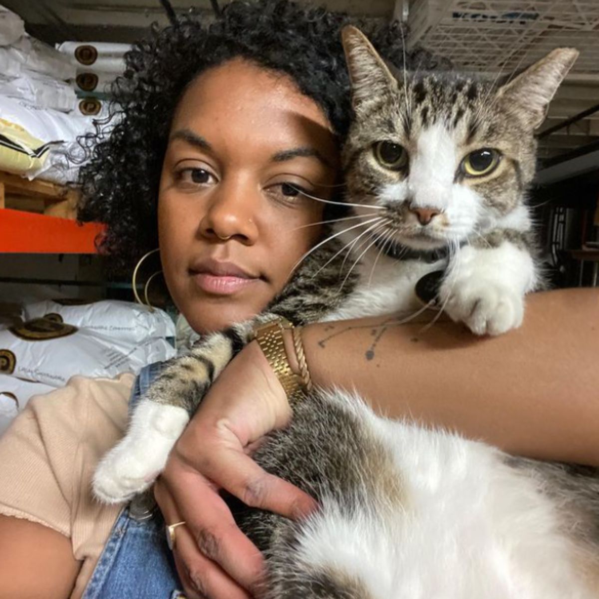 woman holding the sick cat