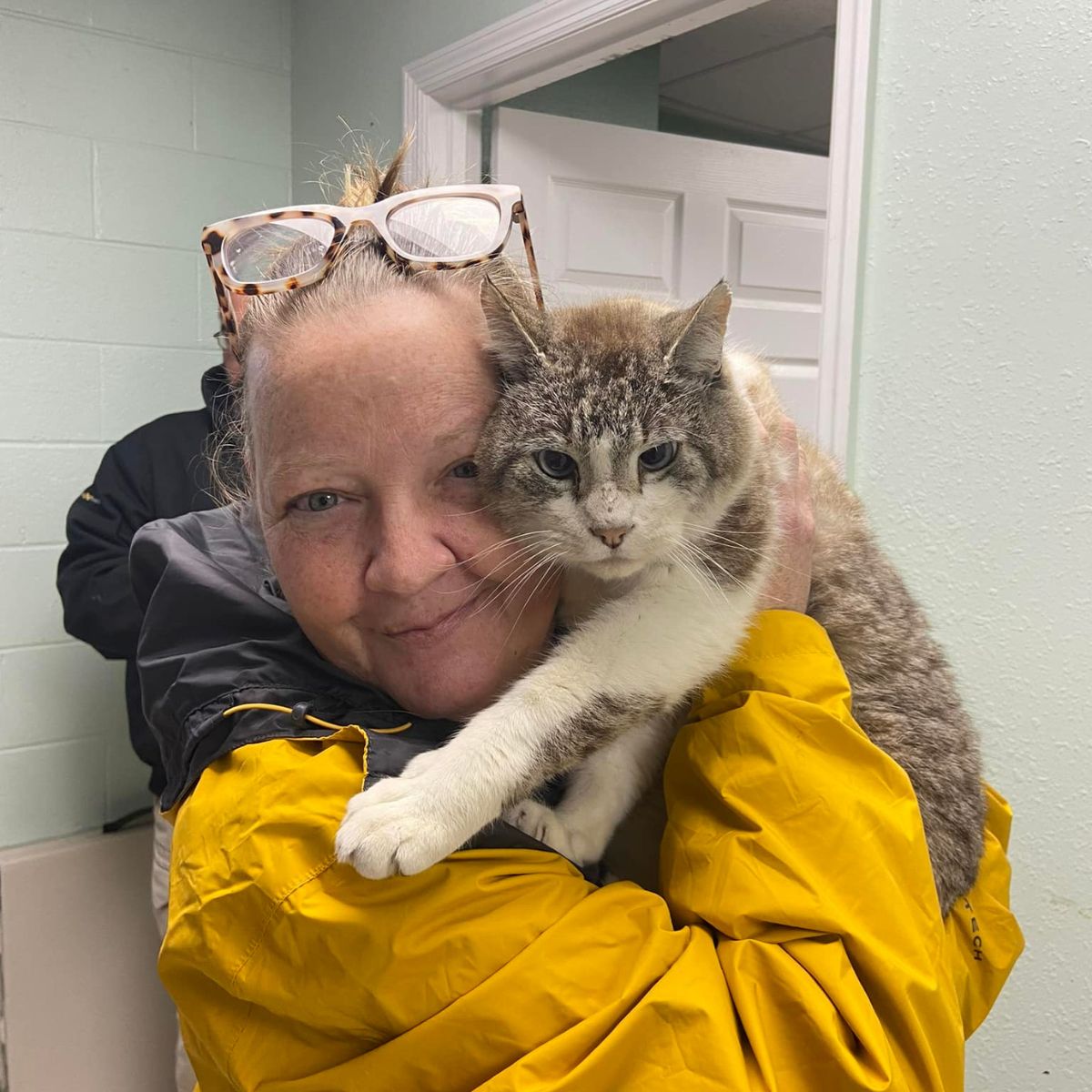 woman hugging the cat