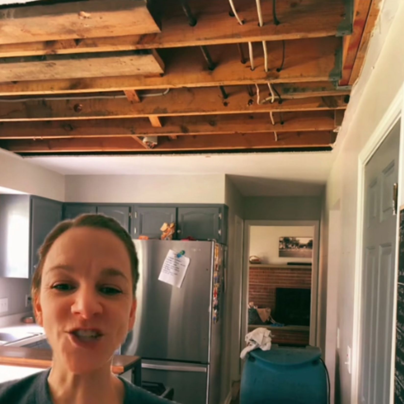 woman in destroyed house