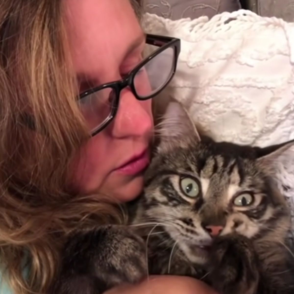 woman lying with a cat